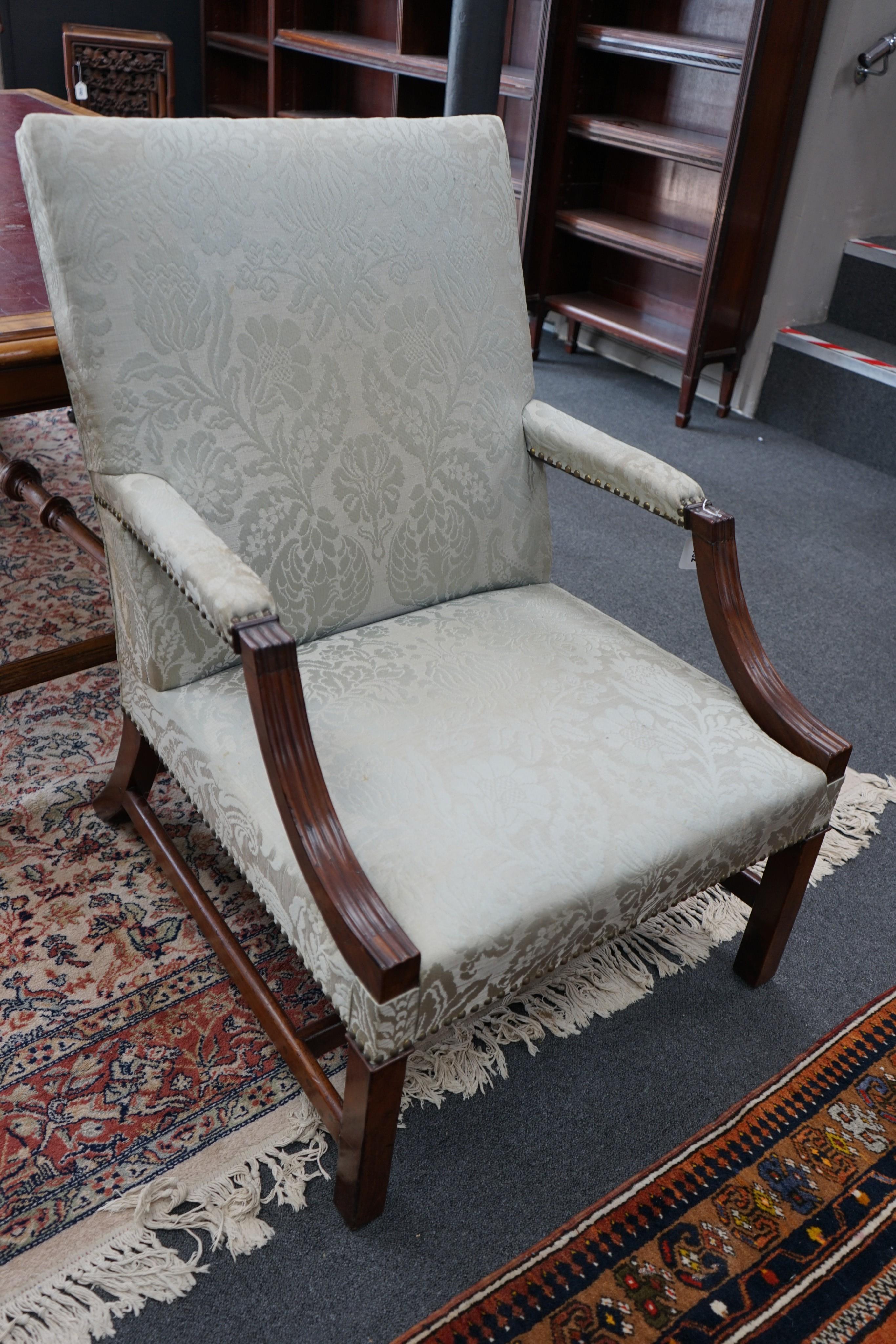 A near pair of George III and later upholstered Gainsborough style mahogany chairs, larger width 70cm, depth 74cm, height 103cm